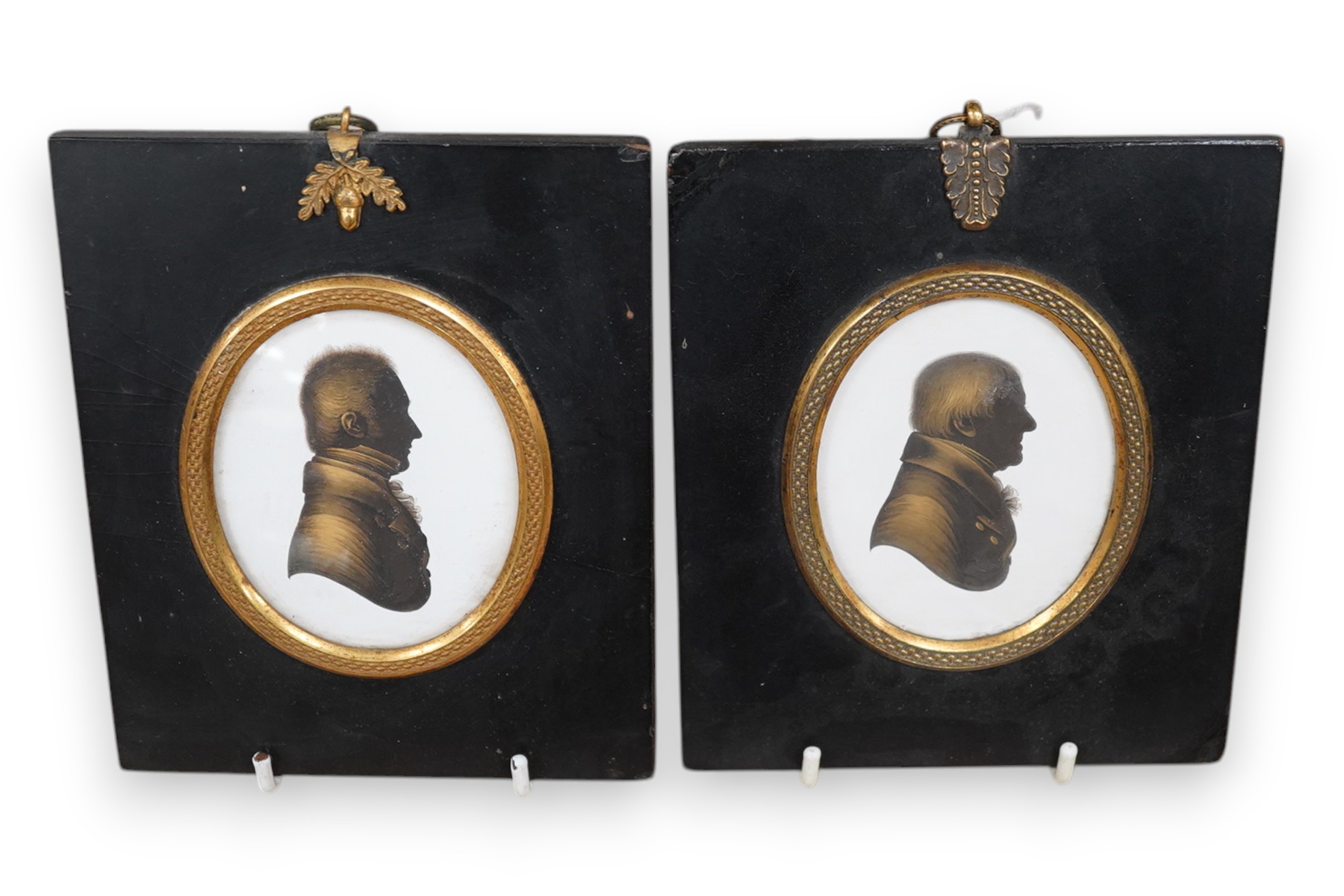 Miers & Field, two bronzed painted plaster silhouettes of gentlemen, framed. Condition - good